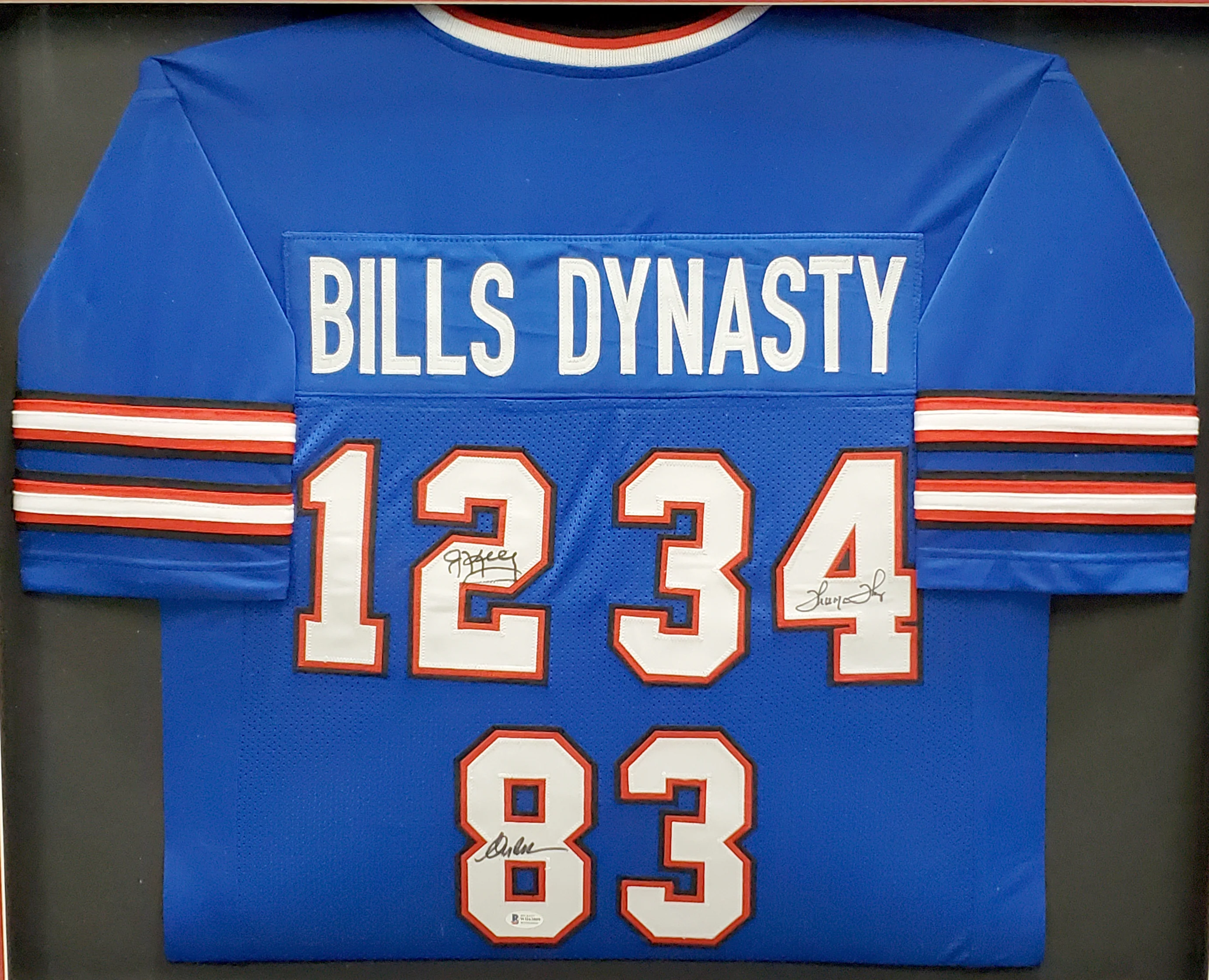 Buffalo Bills Team Greats Autographed Framed Blue Jersey With 3 Signatures Including Jim Kelly, Thurman Thomas & Andre Reed Beckett BAS Stock #195234 - Image 2