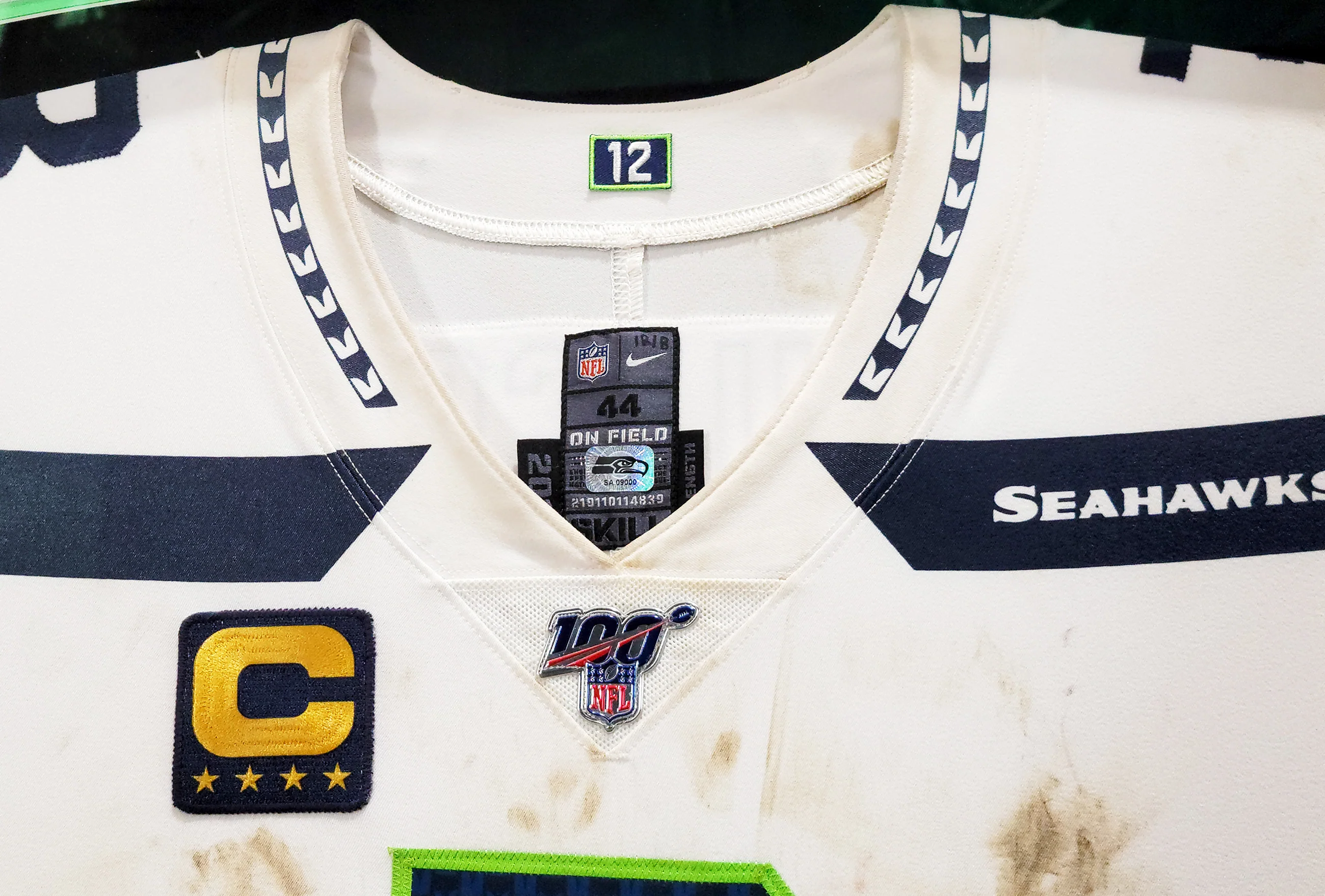 Russell Wilson Framed Game Used Seattle Seahawks White Nike Jersey With Captain's Patch & NFL 100 Logo Unsigned SKU #203517 - Image 4